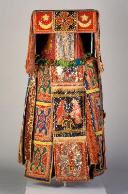 Egungun masquerade costume from Benin with decorative cloth panels and mesh face screen