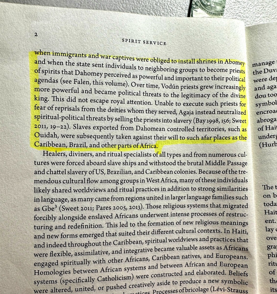 Highlighted page excerpt discussing Dahomey, Vodun priests, political threats, and priests sold into slavery.