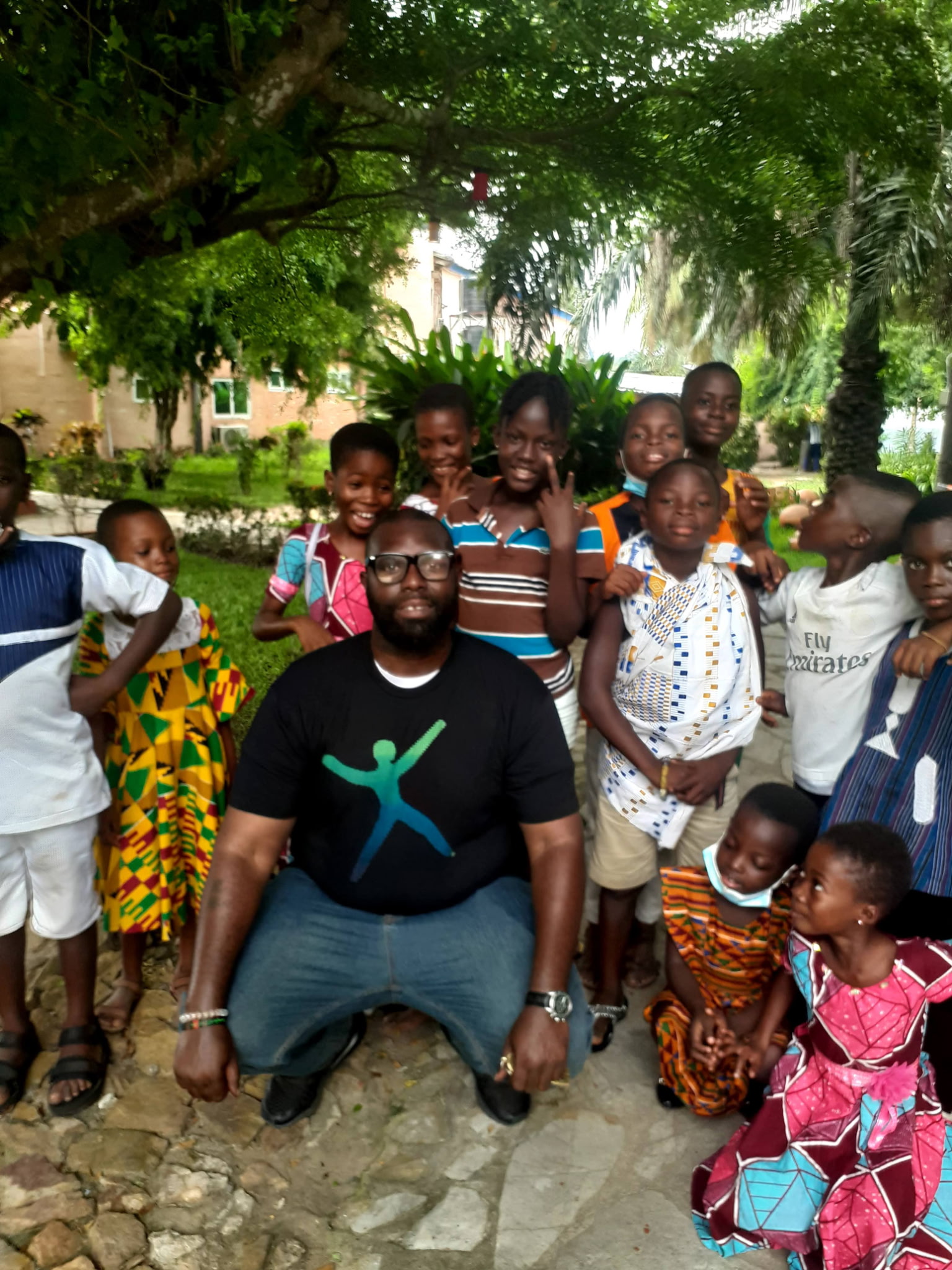 A group of children and an adult outdoors in the photograph supplied for the Clifford Alford Lodge school-project update