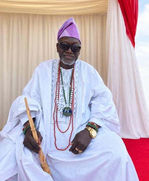 Chief Araba Awodiran Ayinde Okanlawon Agboola seated in white traditional attire